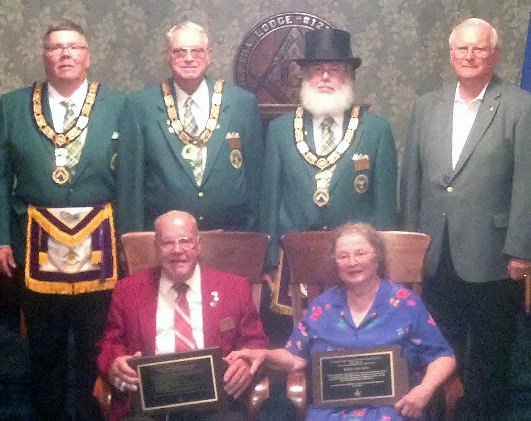 (Back: L-R)Grand Treasurer-Secretary Denny Robinson, PGM; Deputy Grand Master Don Gray; Grand Master Doug McFarland; and Past Grand Master Virgil Andersen honor Past Grand Master Les and Bettie Spies